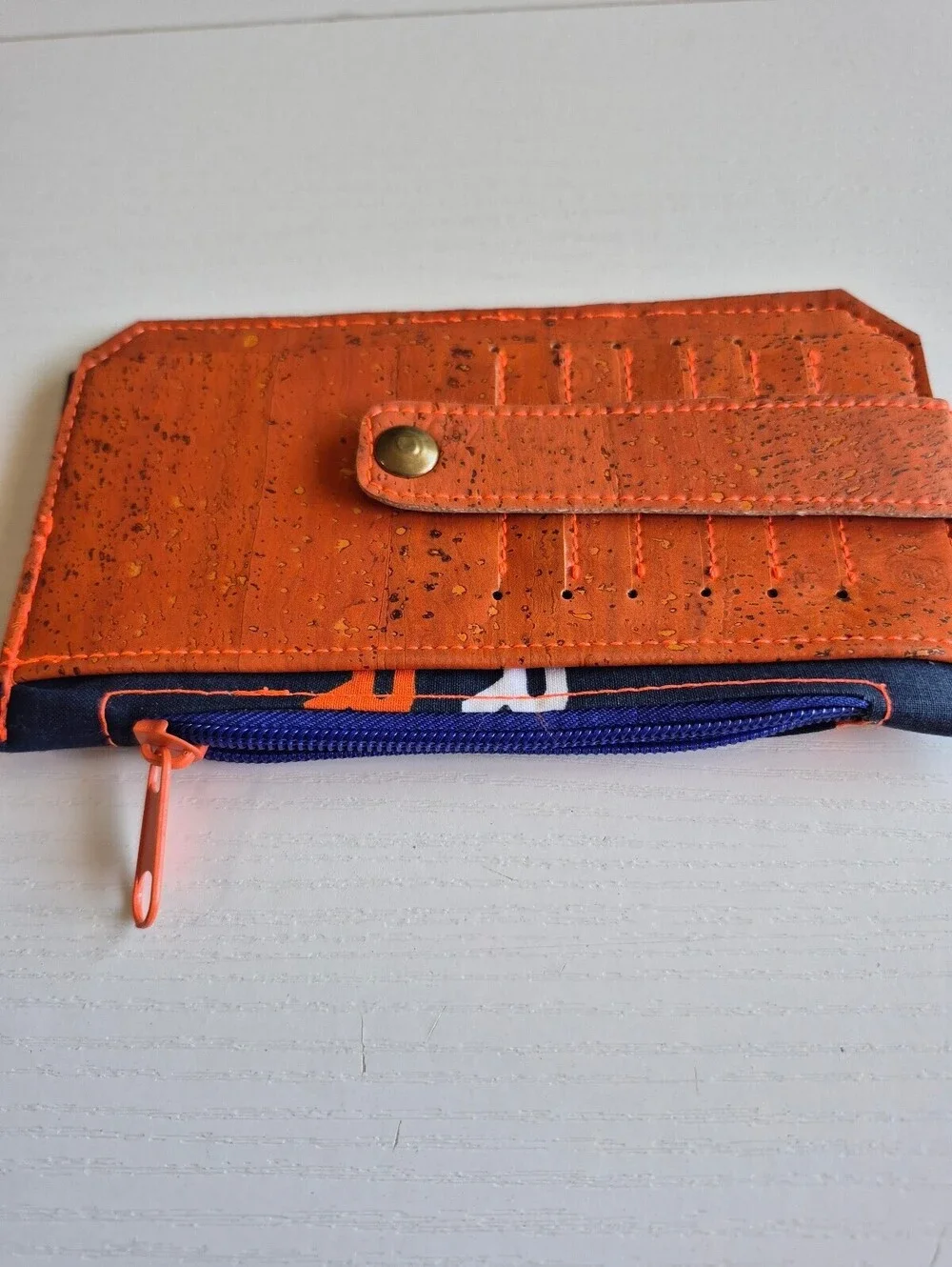 football wallet orange and blue magnetic snap tab 6 card slot wallet